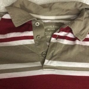 Boys long sleeved striped shirt.